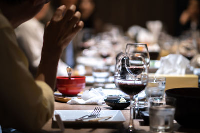 Close-up of wine glasses on table in restaurant