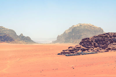 Rock formations on desert against sky