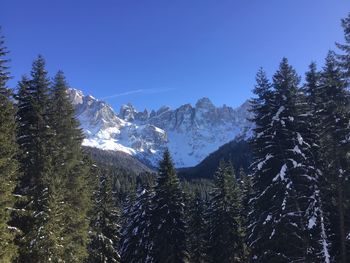 Scenic view of snowcapped mountains against clear sky