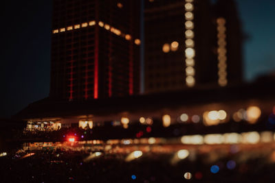 Defocused image of illuminated buildings at night