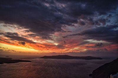 Scenic view of dramatic sky over sea during sunset