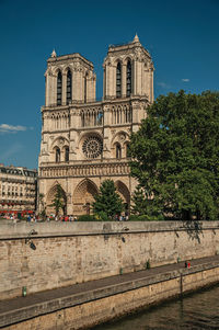 Seine river and the gothic facade of notre-dame cathedral in paris. the famous capital of france.