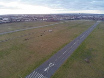 High angle view of airport runway against sky