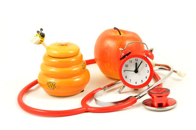 Close-up of clock over white background