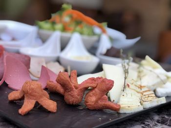 Close-up of serving food on table