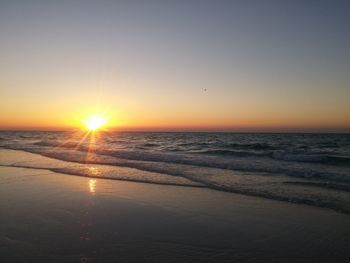 Scenic view of sea against clear sky during sunset