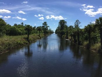 View of canal along trees in park