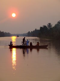 Scenic view of river against sky during sunset