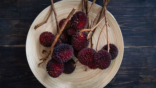 High angle view of strawberries in basket on table