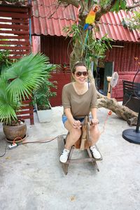 Portrait of young man sitting outdoors