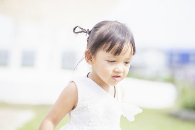 Portrait of cute girl looking away