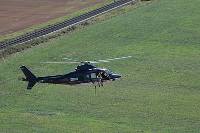 High angle view of airplane flying over land