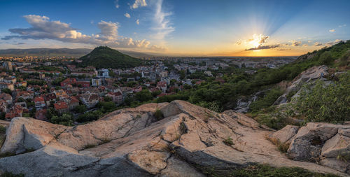 Aerial view of townscape against sky during sunset