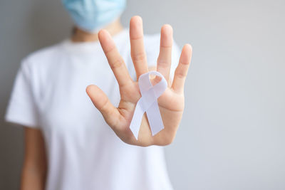 Midsection of woman with text against white background