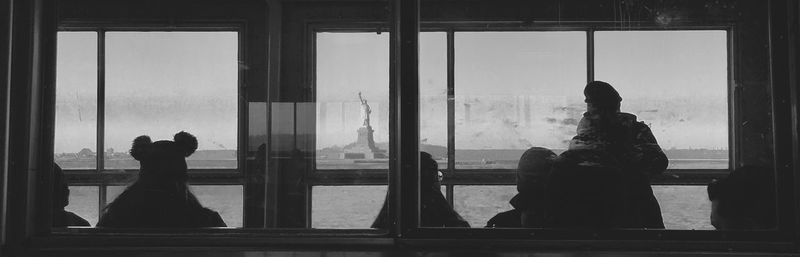 Reflection of people on glass window