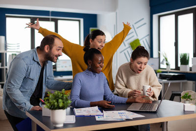 Group of people working on table