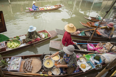 High angle view of venders in boats on floating market