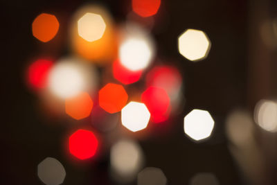 Defocused image of illuminated lights at night