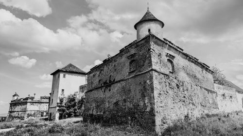 Low angle view of old building against sky