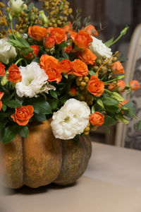 Close-up of orange flowers in vase