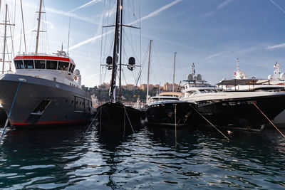 Boats moored at harbor