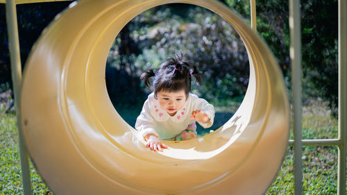 Cute girl playing in playground