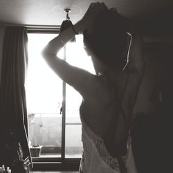 Woman standing by railing