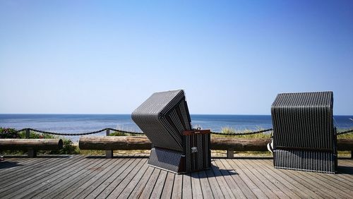 Scenic view of sea against clear blue sky