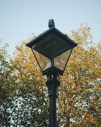 Low angle view of street light against sky