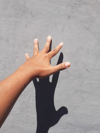 High angle view of woman shadow on wall