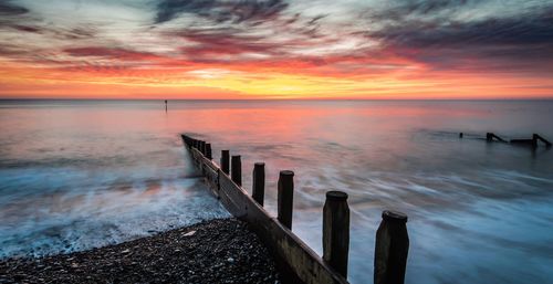 Scenic view of sea against romantic sky