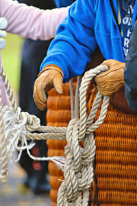 Close-up of man tied up rope hot air balloon 