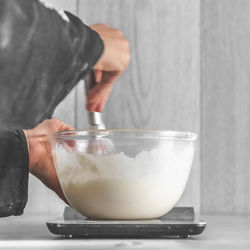 Midsection of woman holding ice cream in bowl