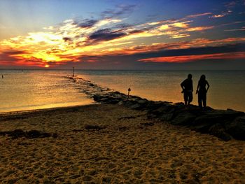 Scenic view of sea at sunset