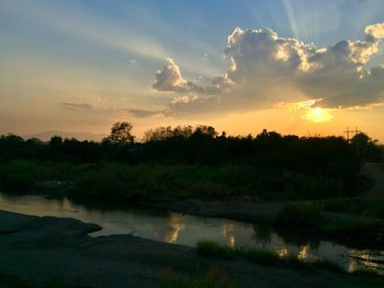Scenic view of lake against sky during sunset