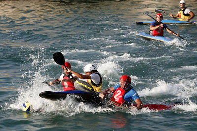 People on boat in river