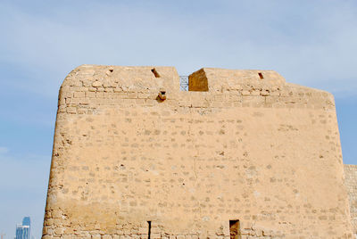 Low angle view of old building against sky