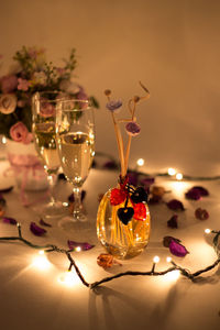 Romantic night valentine theme with wine glass and reed diffuser