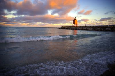 Scenic view of sea against cloudy sky