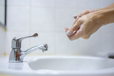 Wash your hands, soap your hands. women's hands are washed with soap. hand hygiene, skin care