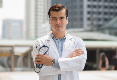 Portrait of smiling man standing outdoors