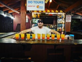 Portrait of smiling man sitting in restaurant