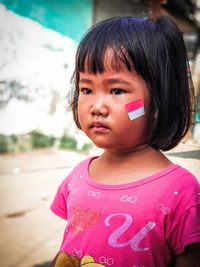 Portrait of cute girl looking away