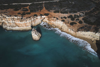 High angle view of rock formation in sea