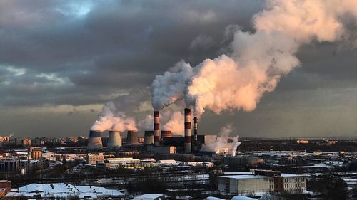 Panoramic view of factory against sky