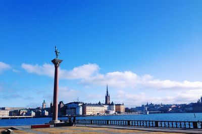 View of buildings against blue sky