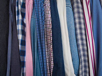 Close-up of clothes hanging on rack in store