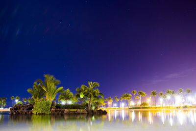 Scenic view of swimming pool against sky at night