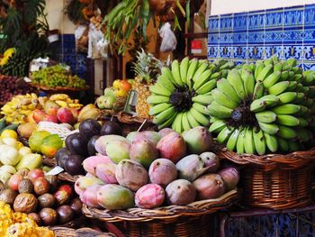 Various fruits in basket for sale at market stall