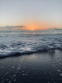 Scenic view of sea against sky during sunset